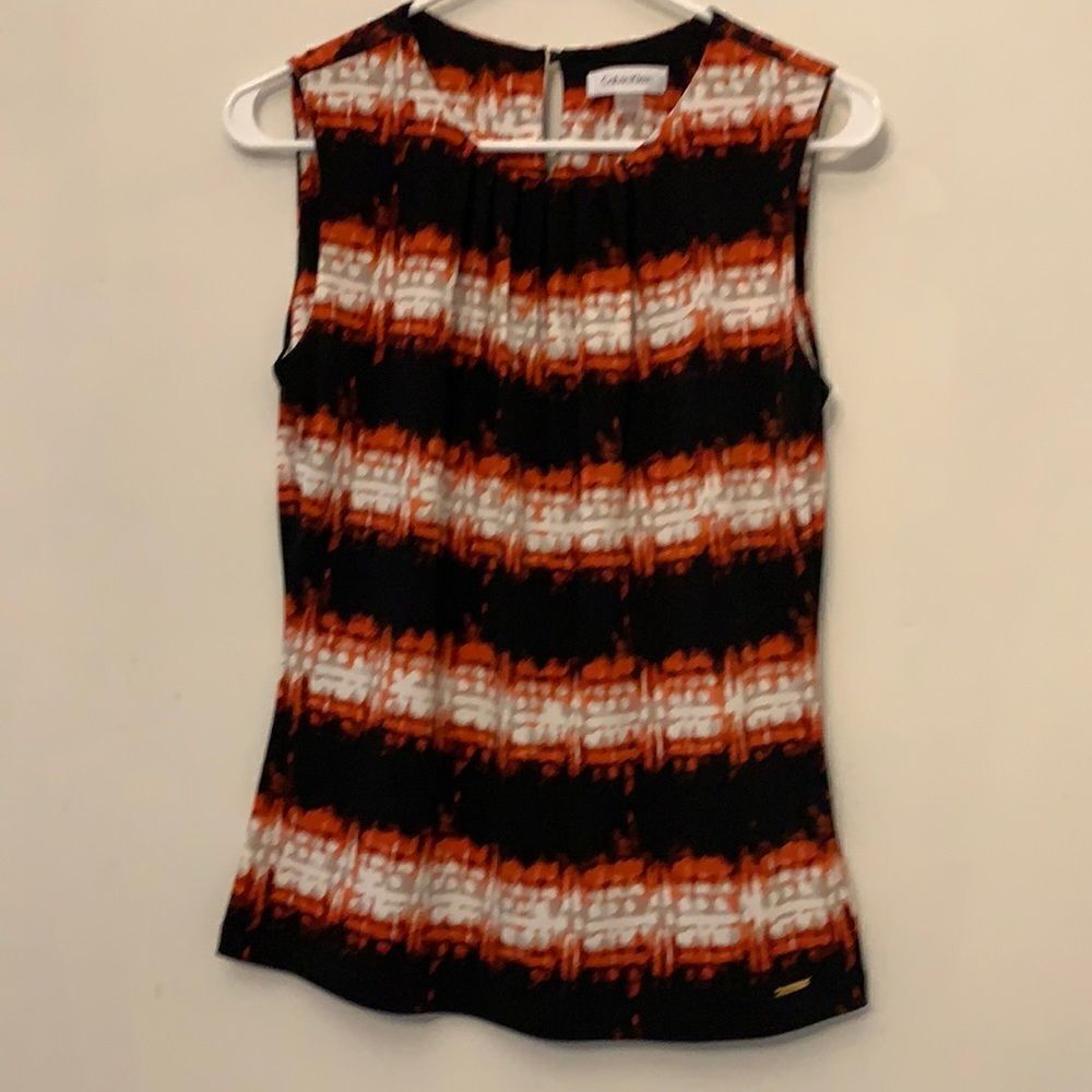 Calvin Klein sleeveless multi colored blouse. Length 24” Size S. Keyhole back
